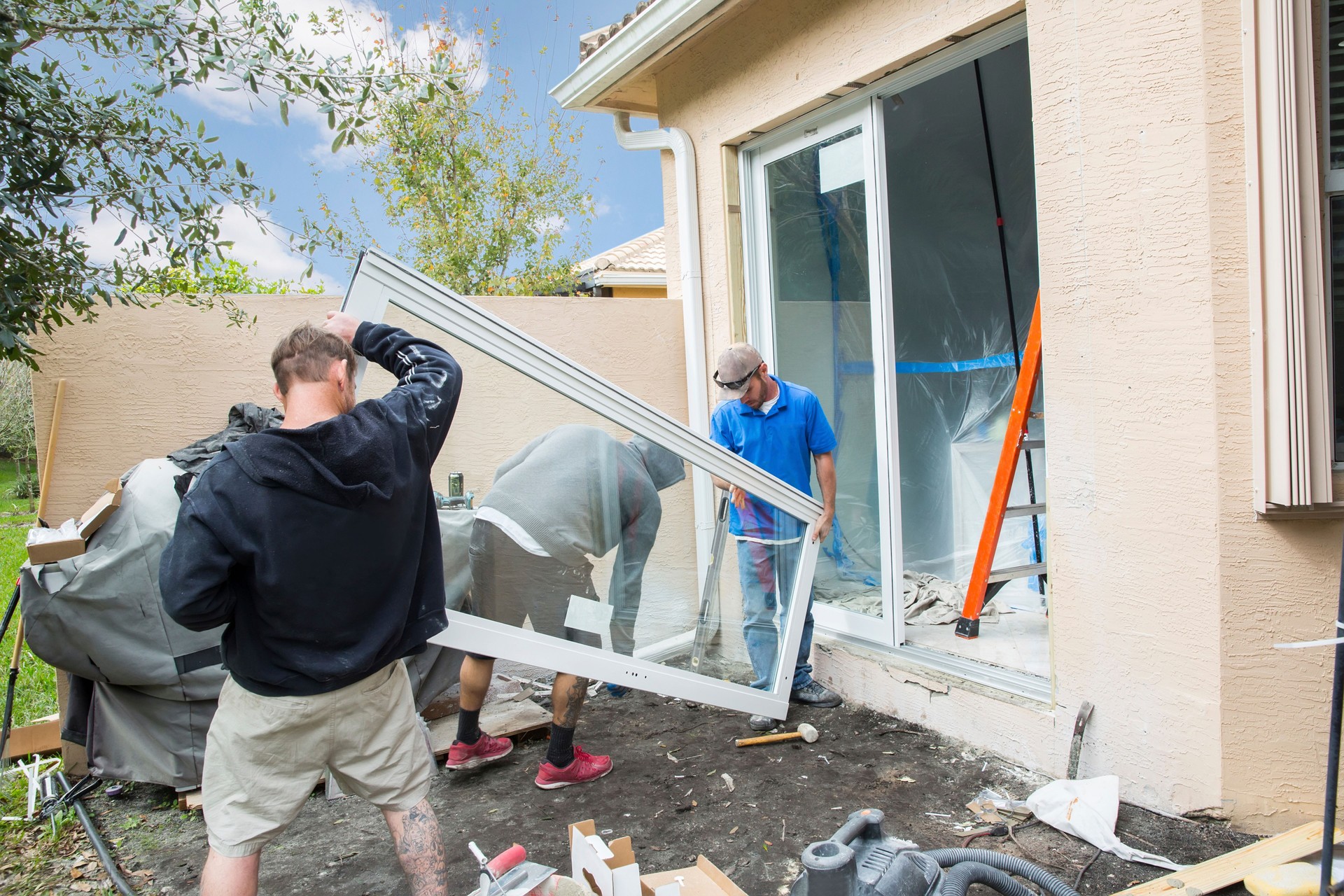 Series:Installing sliding glass door with hurricane impact glass in home.